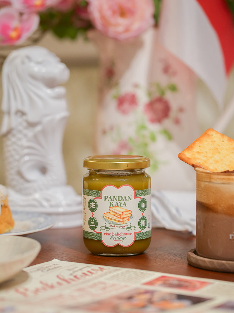 Jar of Pandan Kaya on a table with a blurred background